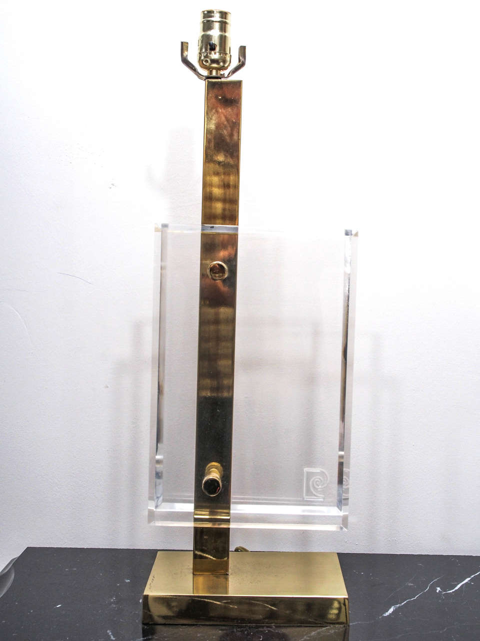 Table lamp in brass and Lucite by Pierre Cardin, the beveled panels separated by the central stem; one panel marked with Cardin's 